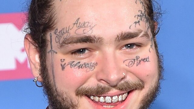 Post Malone performing in a cowboy hat during the Big Ass Stadium Tour