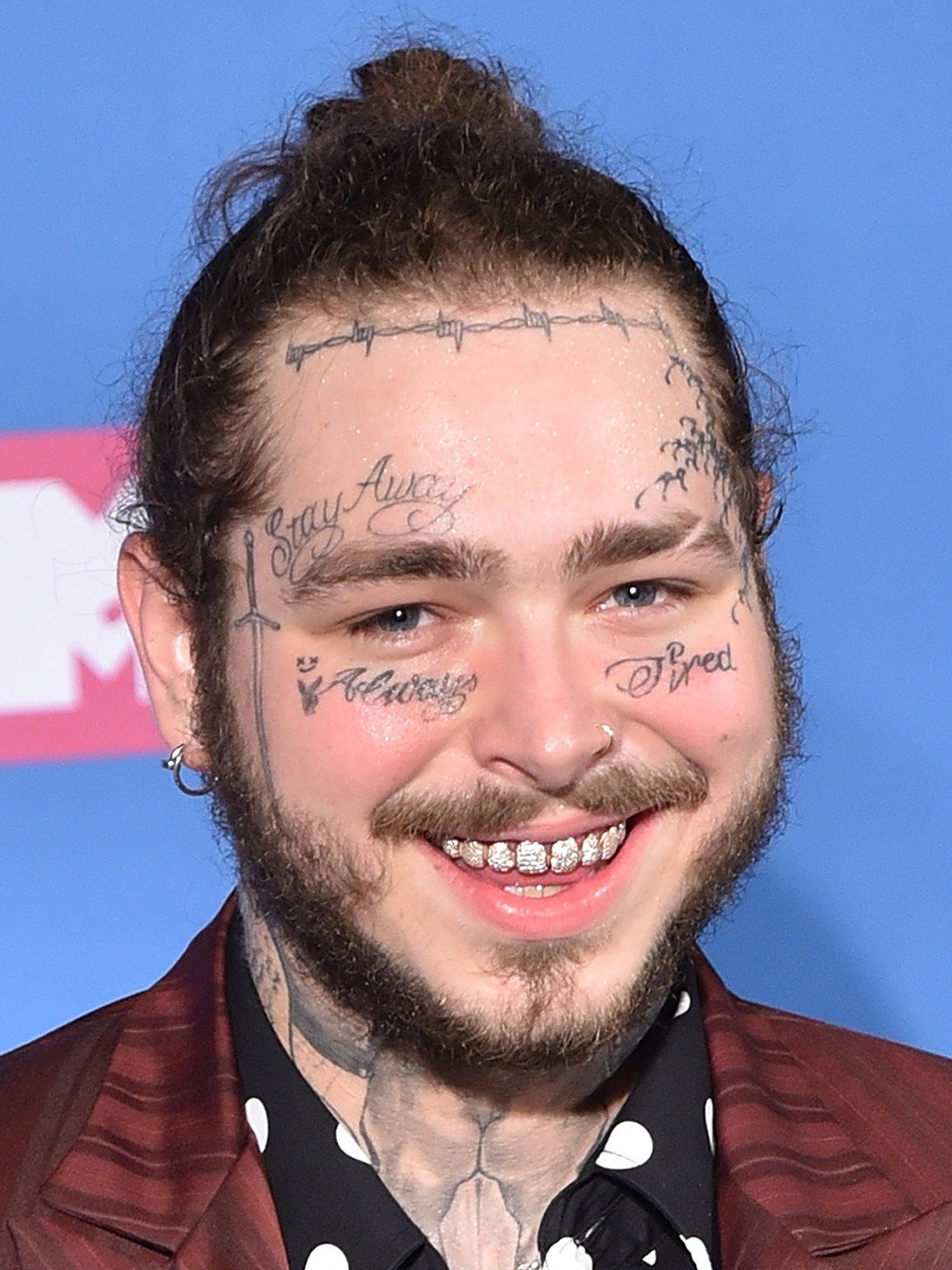 Post Malone performing in a cowboy hat during the Big Ass Stadium Tour