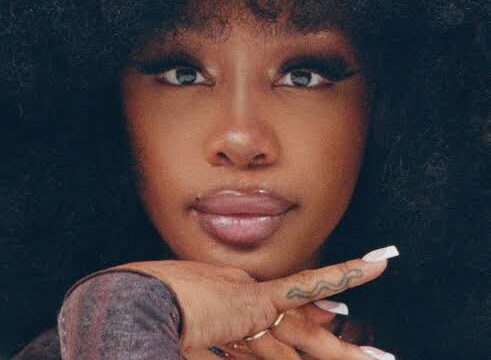 SZA performing on stage during the Grand National Tour in 2025