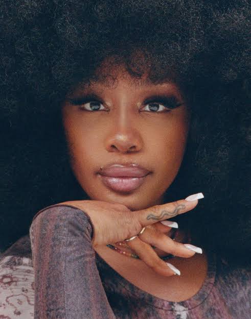 SZA performing on stage during the Grand National Tour in 2025