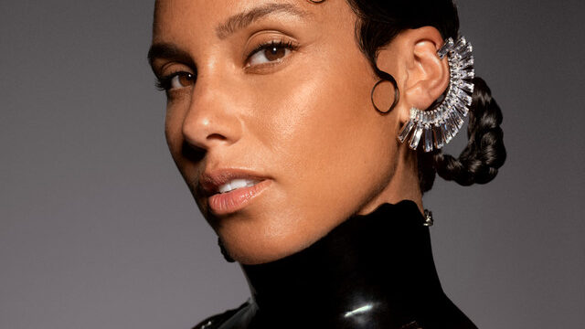 Alicia Keys performing at the piano on stage