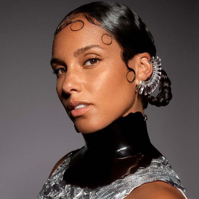 Alicia Keys performing at the piano on stage